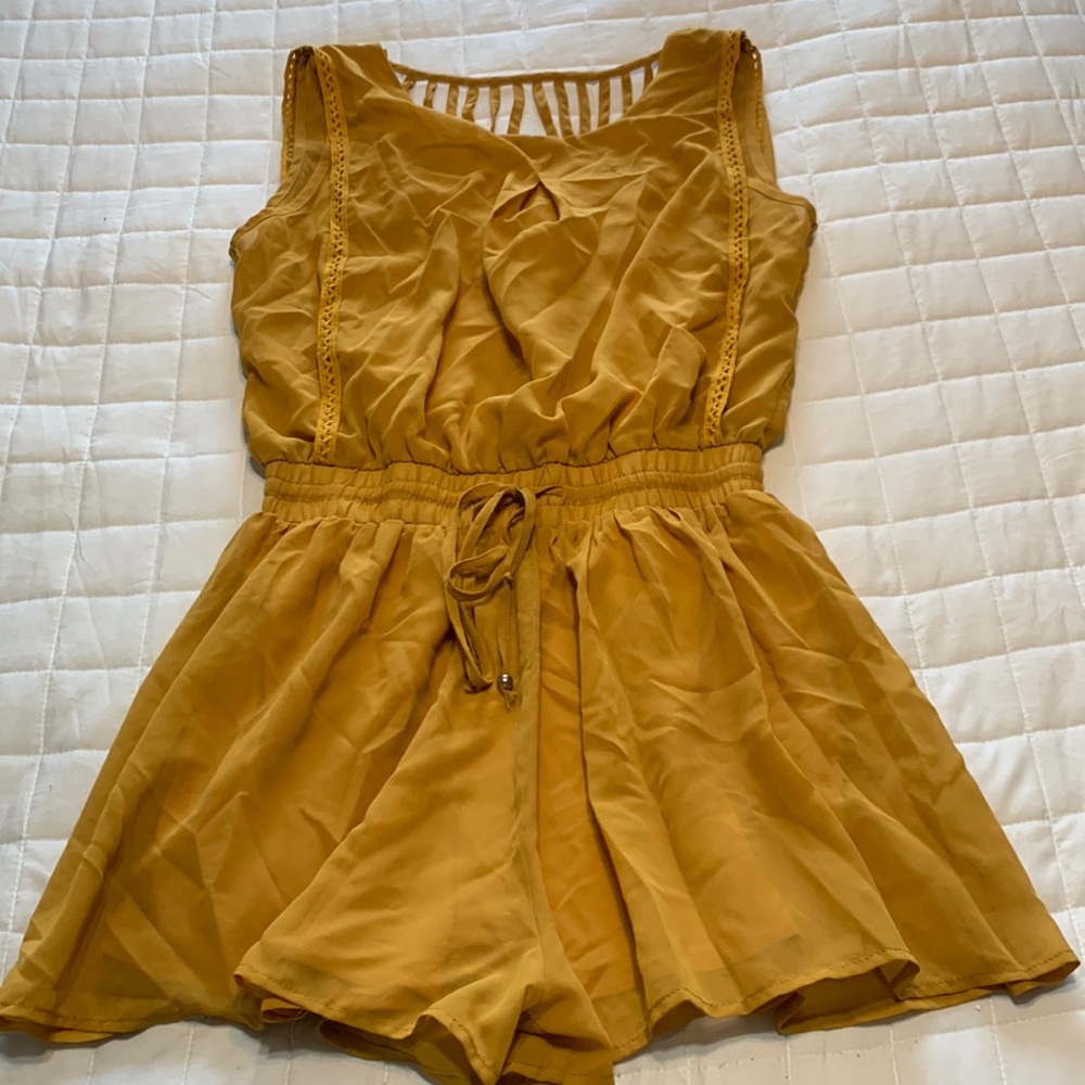 Mustard yellow romper with draped back and strap detail
